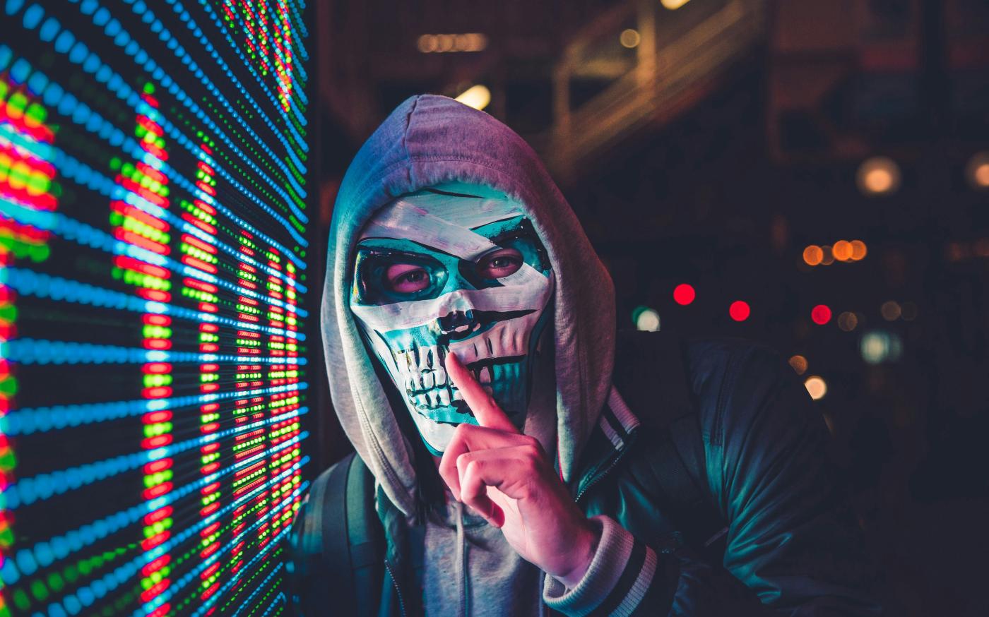 person standing near LED sign by Max Bender courtesy of Unsplash.