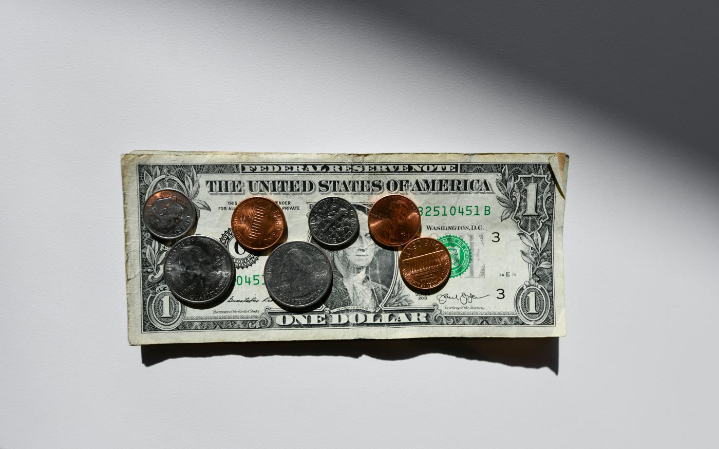 silver and gold round coins in box by Kenny Eliason courtesy of Unsplash.
